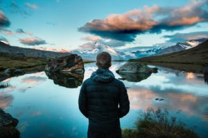 Contemplation by person overlooking water scene