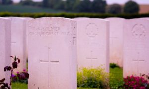 WW1 headstones, pink kshaded and one is Australian with rising sun